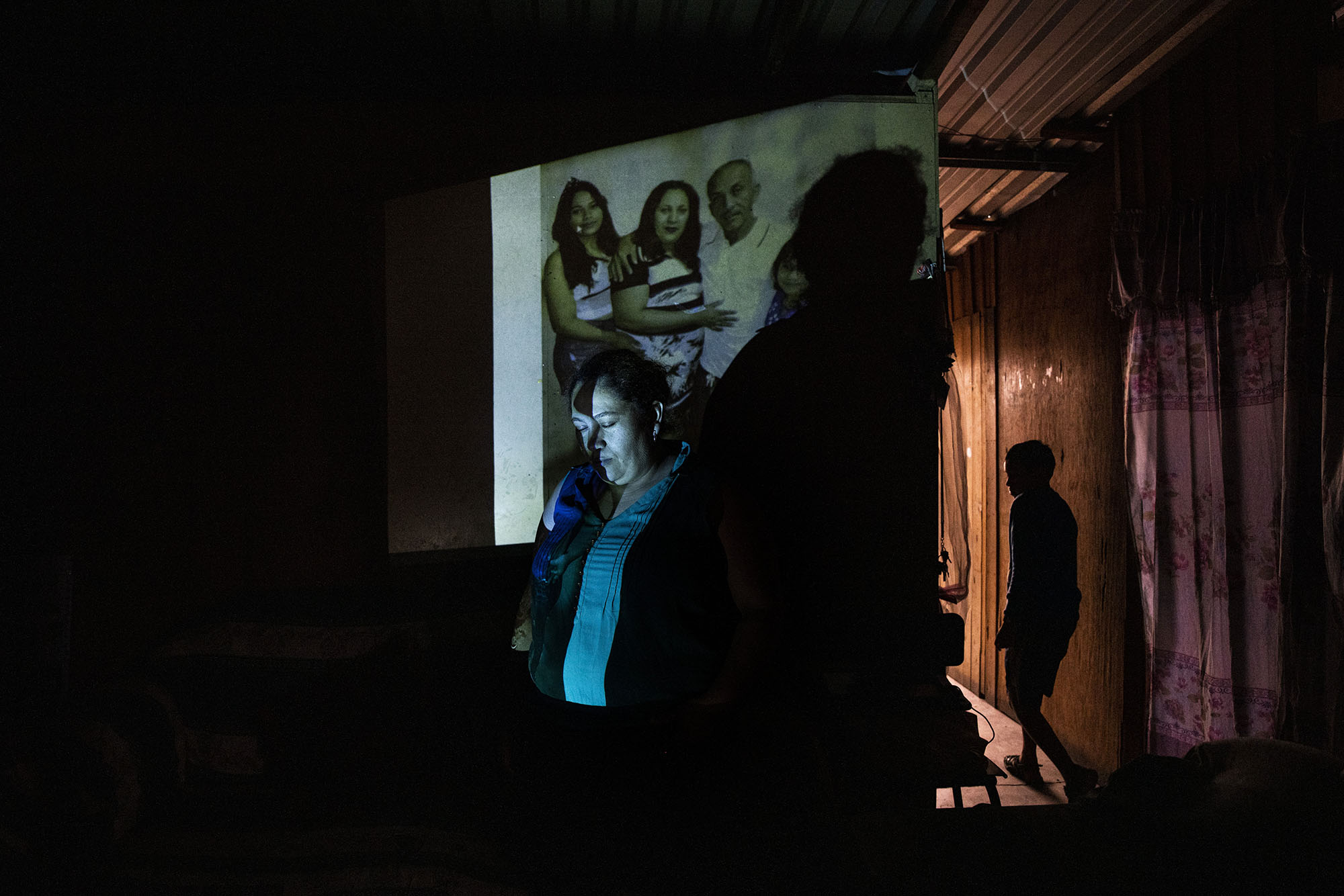 A.E.A., 34, a survivor of sexual violence stands inside her home in the Neuva Capital neighbourhood of Tegucigalpa.